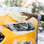 Luxury car covered by foam.